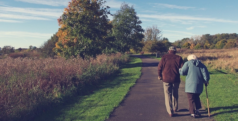 old people walking down the road