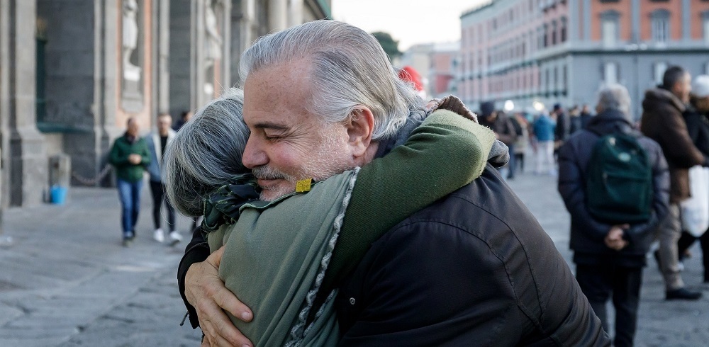 man and woman hugging